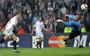 AC Milan's Ambrosini scores against PSV Eindhoven goalkeeper Gomes during Champions League semi-final soccer match at Philips stadium in Eindhoven, the Netherlands